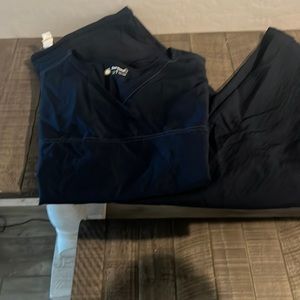 Navy blue scrubs by wink. Top size 2x bottom xl